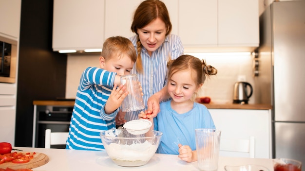 Front view of family cooking at home