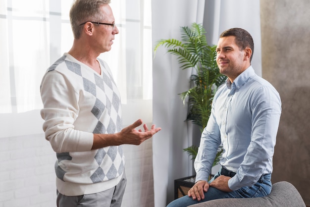 Front view of father and son talking