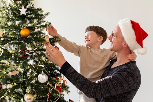 Front view of father and son with christmas