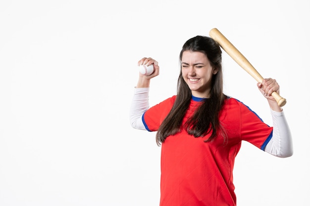 Front view female baseball player with bat and ball