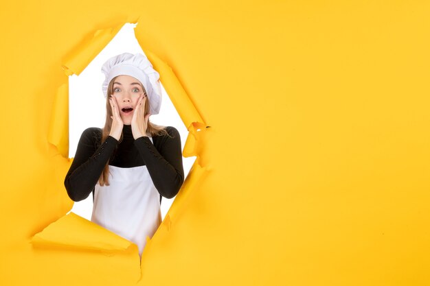 Front view female cook on yellow color sun paper emotion food job photo cuisine