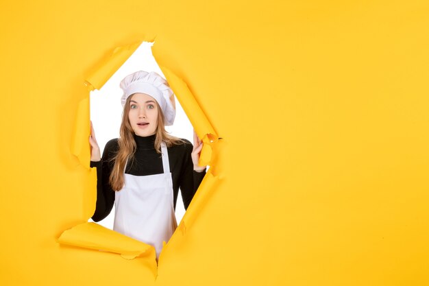 Front view female cook on a yellow color sun photo cuisine job paper emotion food