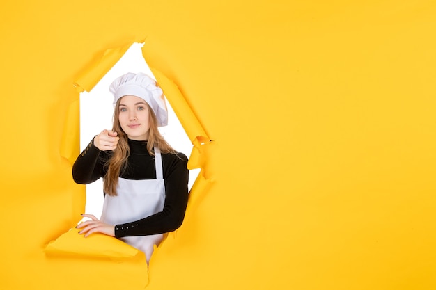 Front view female cook on the yellow color sun photo cuisine paper emotion food job