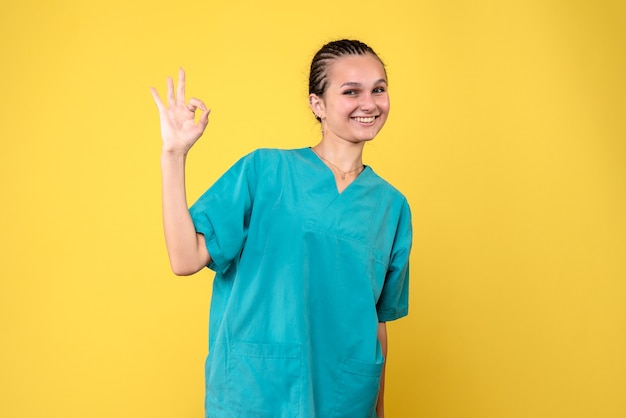 Free photo front view female doctor in medical shirt, covid-19 health hospital virus color nurse