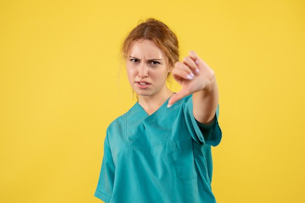 Front view female doctor in medical shirt displeased, health medic covid color hospital nurse