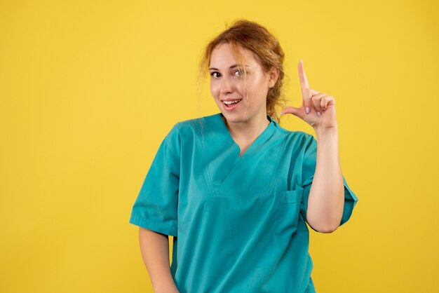 Front view female doctor in medical shirt, health medic covid-19 color hospital nurse