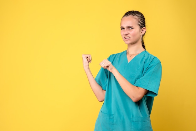 Front view female doctor in medical shirt, health medic emotion covid nurse hospital color