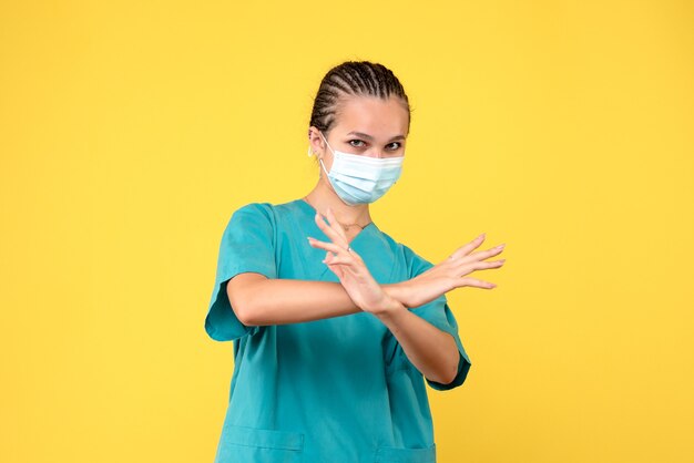 Front view female doctor in medical shirt and mask, health nurse pandemic covid-19 medic hospital