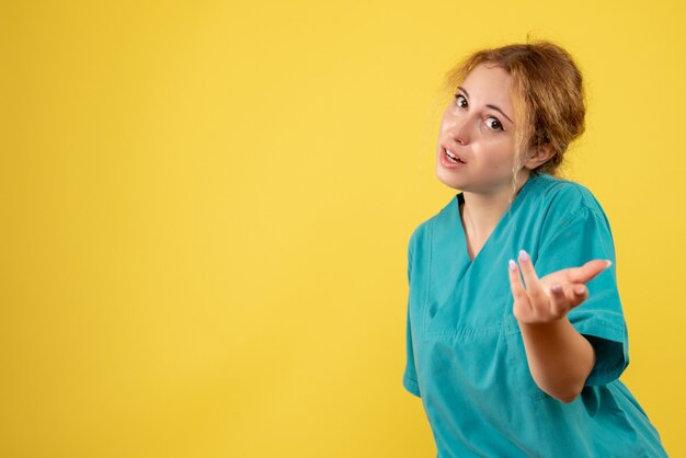 Front view female doctor in medical shirt, medic nurse covid-19 health color