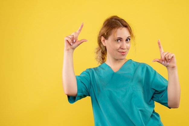 Front view female doctor in medical shirt, medic nurse covid-19 health color