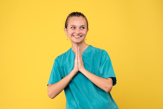 Free photo front view female doctor in medical shirt, nurse covid-19 virus color emotion hospital