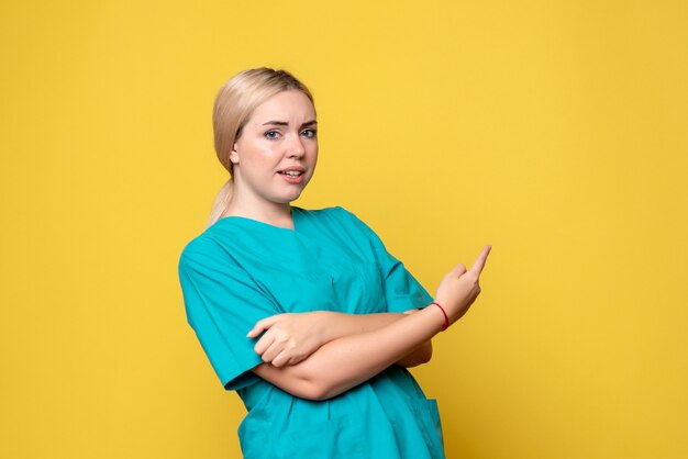 Free photo front view female doctor in medical shirt, pandemic nurse medic emotion covid-19