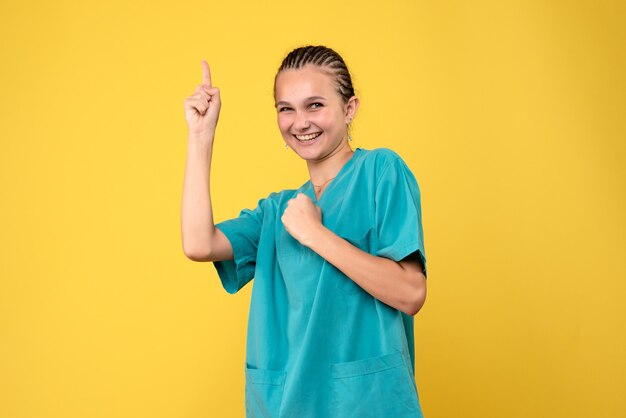 Front view female doctor in medical shirt smiling, medic health emotion covid color nurse hospital