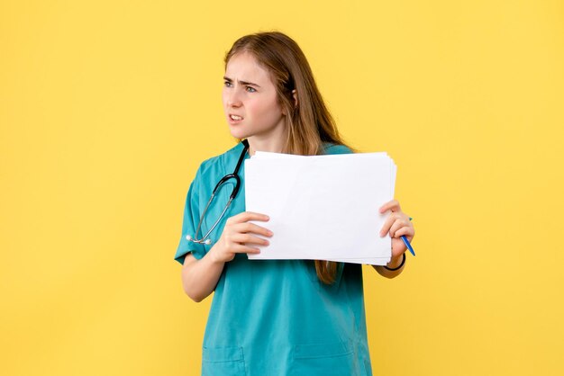 Front view of female doctor with documentation