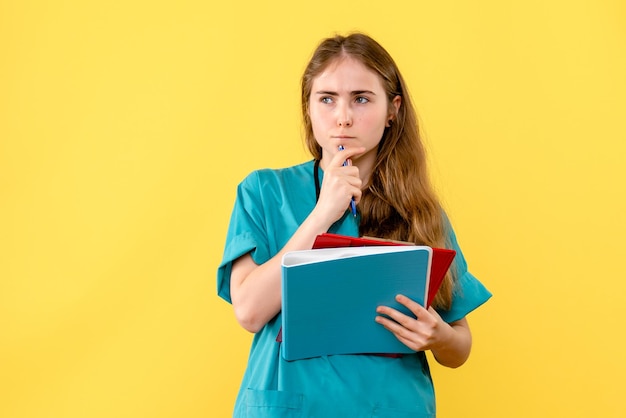 Front view of female doctor with medical notes