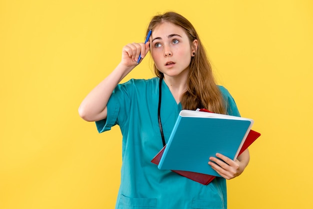 Front view of female doctor with medical notes