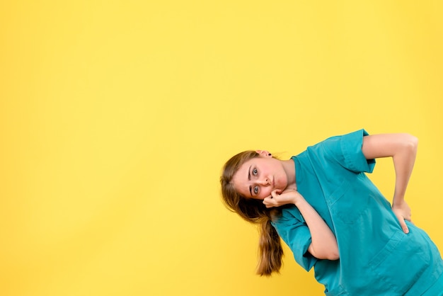 Free Photo front view female doctor on yellow background health medic emotion virus hospital