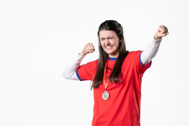 Front view female player in sport clothes with medal