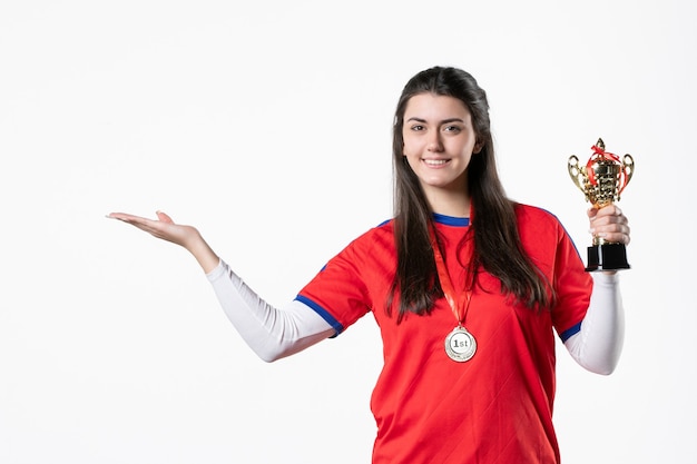 Front view female player with golden cup and medal