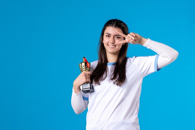 Front view female player with trophy