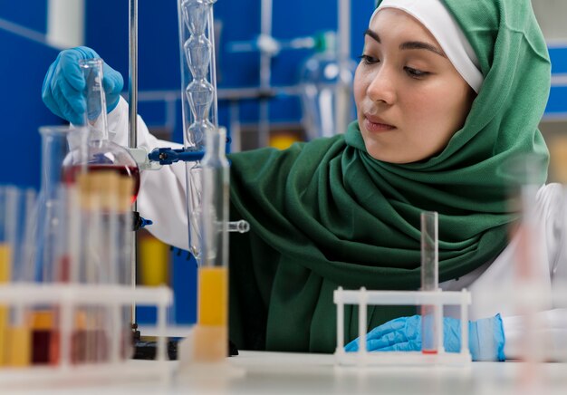 Front view of female scientist with hijab in the laboratory