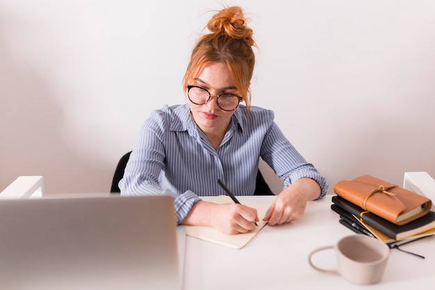 Front view of female teacher at home during an online class