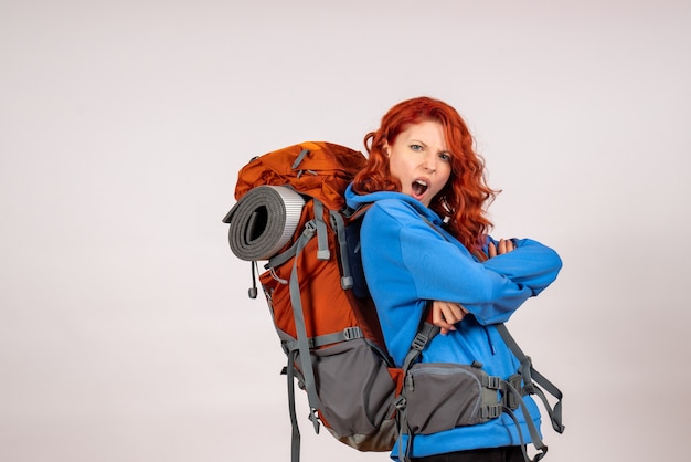 Free Photo front view female tourist going in mountain trip with backpack