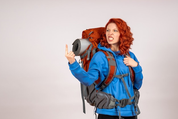 Free Photo front view female tourist going in mountain trip with backpack