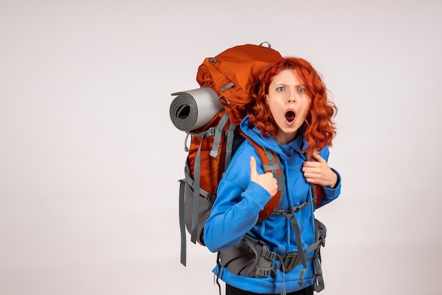 Free Photo front view female tourist going in mountain trip with backpack