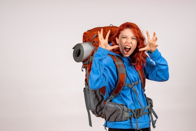 Free photo front view female tourist going in mountain trip with backpack