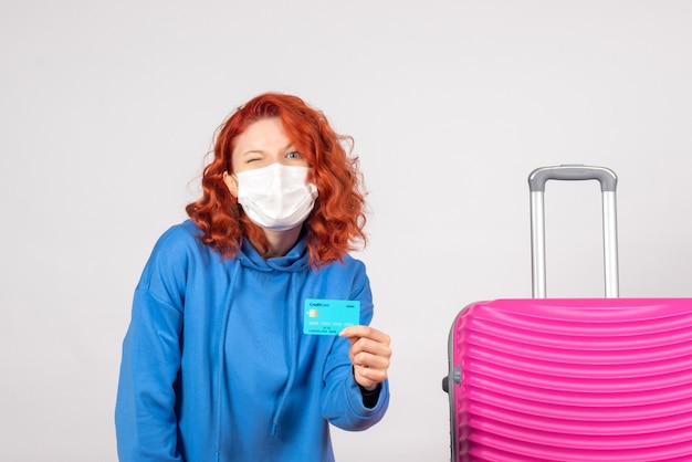 Free photo front view female tourist holding bank card