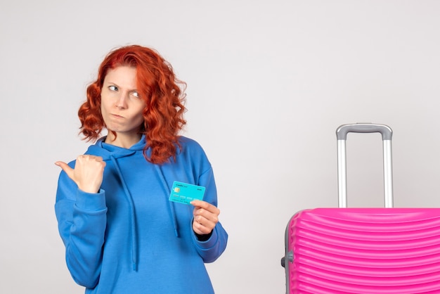 Free photo front view female tourist holding bank card