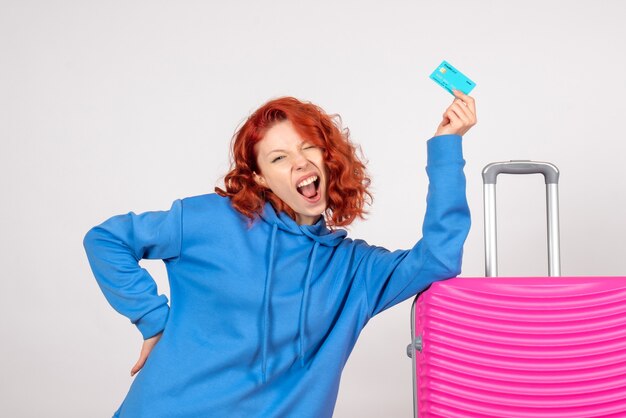 Free photo front view female tourist with pink bag and holding bank card