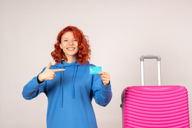 Free photo front view female tourist with pink bag and holding bank card