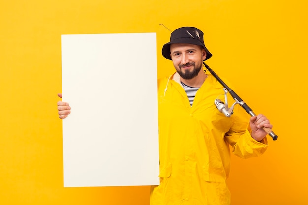 Free Photo front view of fisherman with rod holding blank placard