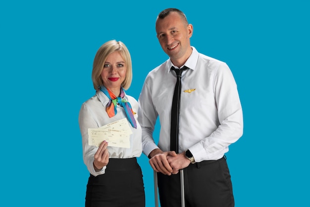 Free photo front view flight attendants with tickets