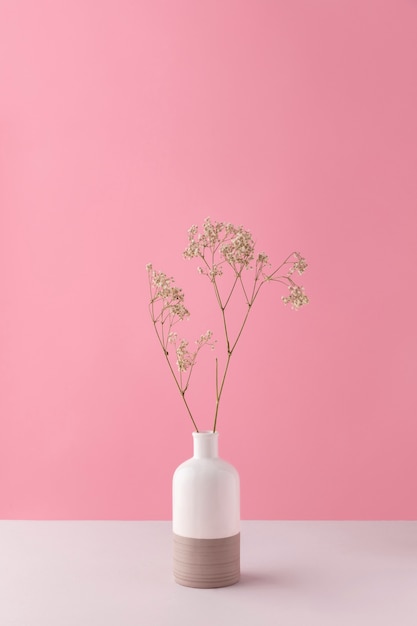 Free photo front view of flower decor in a vase with copy space