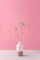 Free photo front view of flower decor in a vase with copy space