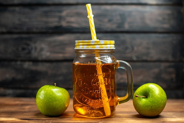 Front view fresh apple juice inside can with straw on dark cocktail fruit drink photo colors