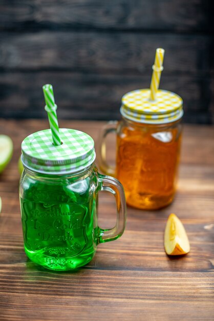 Front view fresh apple juice inside cans on dark fruits drink photo cocktail bar color