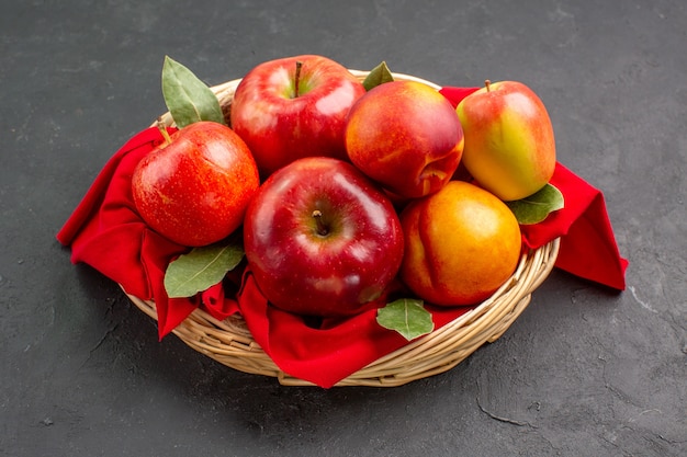 Front view fresh apples with peaches inside basket on dark table tree fresh fruit ripe