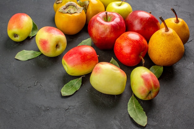 Front view fresh apples with pears and persimmons on dark table mellow fresh ripe