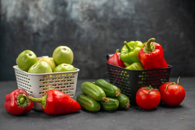 Front view fresh bell-pepper with green tomatoes and other vegetables on dark background diet food health salad meal