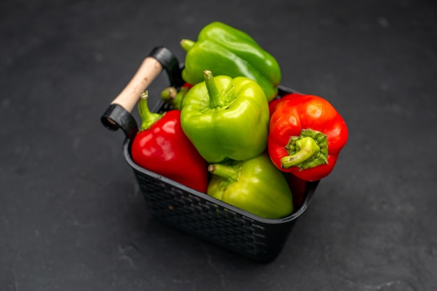 Free photo front view fresh bell-peppers inside basket on dark background meal salad color photo ripe