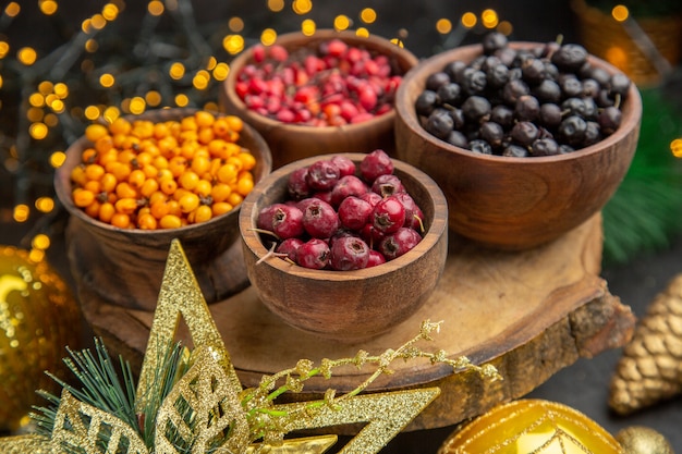 Front view fresh berries on dark background fruit color photo fresh taste wild mellow many xmas