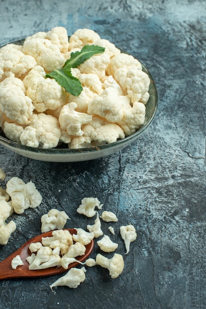 Front view fresh cauliflower inside plate on light-grey surface