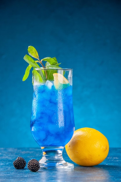 Front view fresh cool lemonade inside little glass with ice on blue background water cold juice cocktail color bar drink fruit