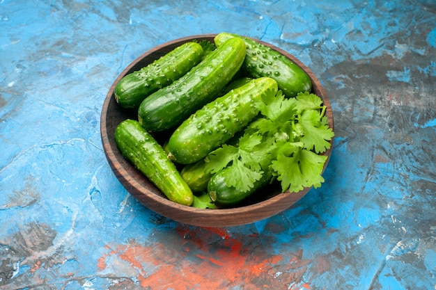 Front view fresh cucumbers inside plate on blue background  ripe food meal color salad