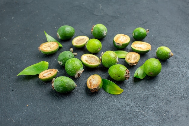 Front view fresh feijoas on dark surface