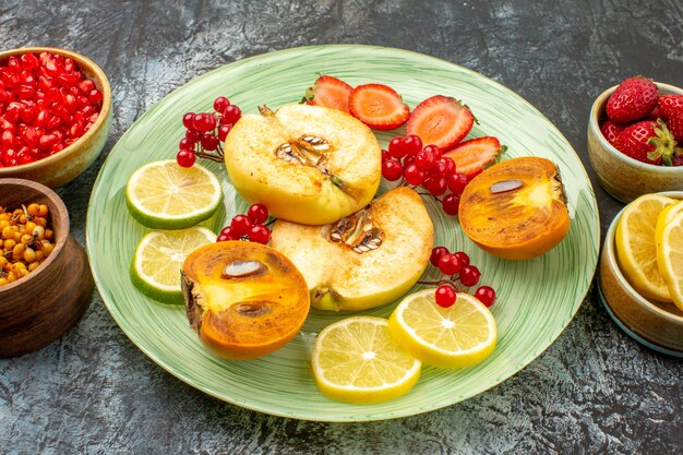 Front view fresh fruits quinces lemons and other fruits on light floor